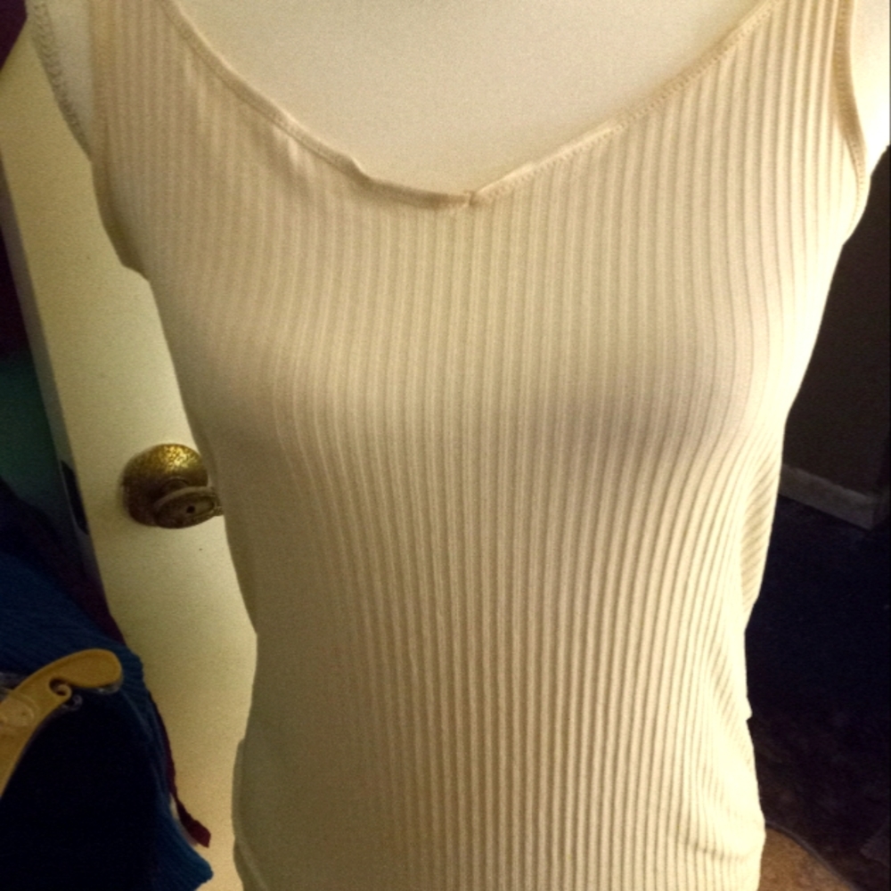 Used,not new  cream colored ribbed stretch knit camisole. size is medium.